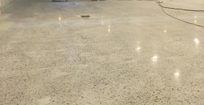 Hard at work polishing the floor at Cheki Uganda offices